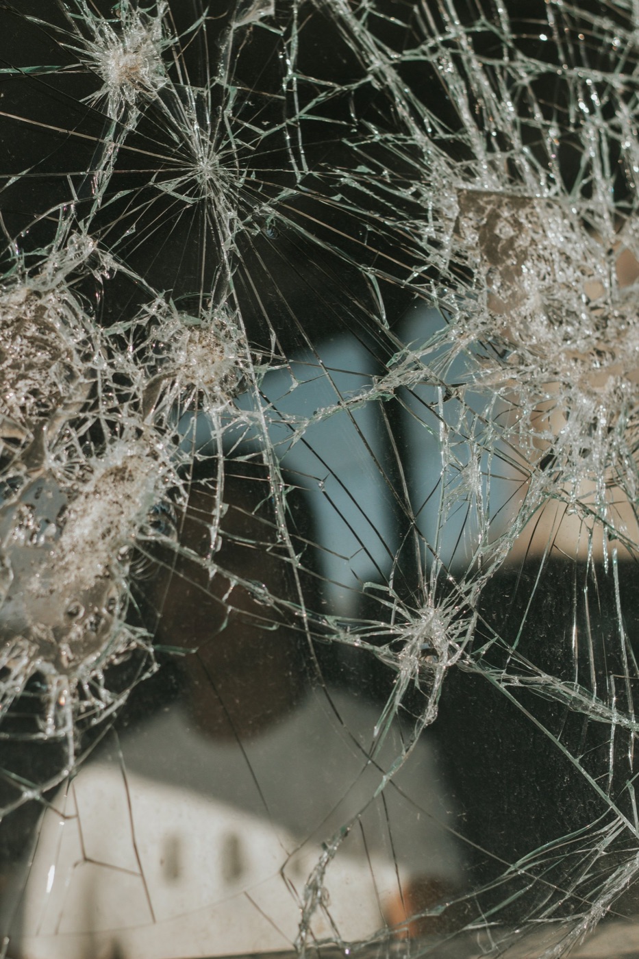 A smashed window pane close up, with the stamp bar at the bottom of the image: date and time, address, position, file and name